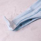 Emile et Rose baby boys blue babygrow leg popper fastening detail