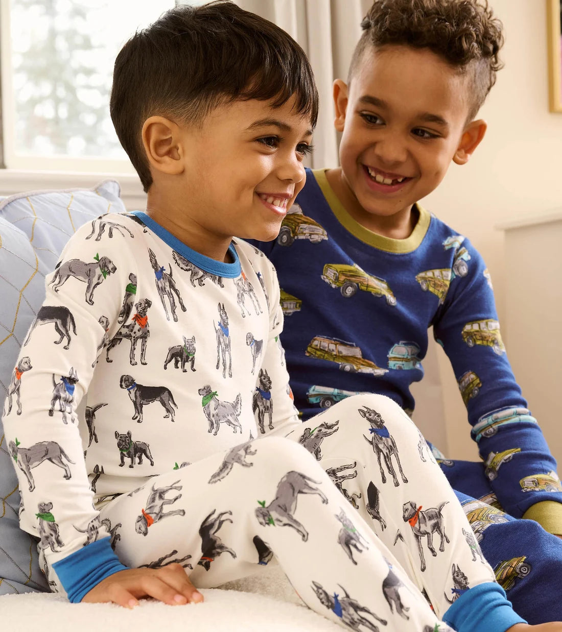 Hatley Boys Vintage Trucks pyjamas worn by child showing blue printed two-piece PJs