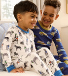 Hatley Boys Vintage Trucks pyjamas worn by child showing blue printed two-piece PJs
