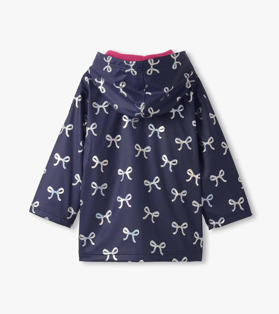 Hatley girls waterproof raincoat in navy with holographic ribbon design – back view