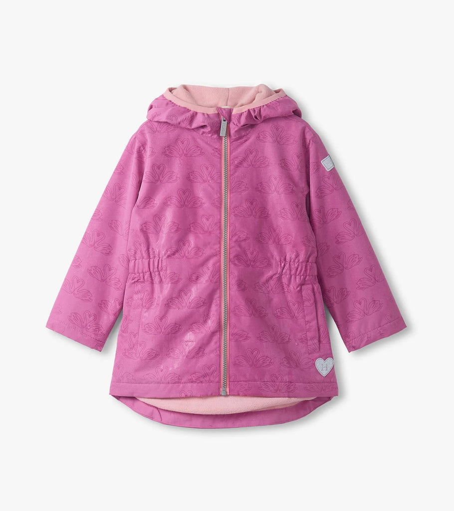 Close-up of colour-reveal swan-heart print on Hatley girls pink waterproof field jacket