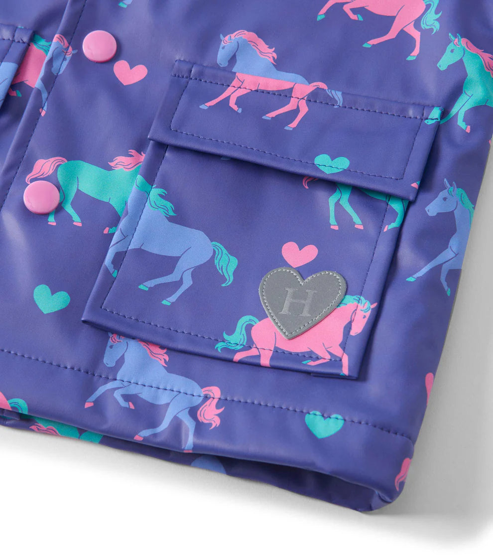 Patch Pocket detail on Hatley Hearts & Horses kids purple raincoat