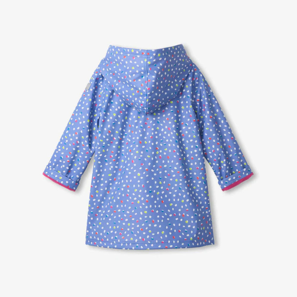 Back view of Hatley girls waterproof polka dot raincoat with hood and pink towelling lining
