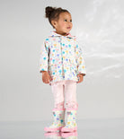 Hatley girls floral raincoat worn with pink leggings and rain boots