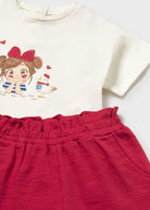 Mayoral girls cream T-shirt with illustrated girl and red trousers detail