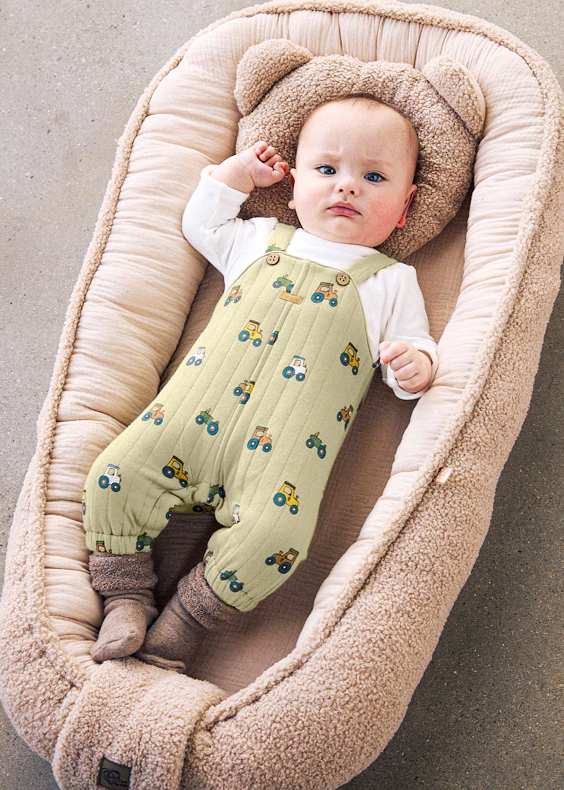     Mayoral newborn baby boy wearing a green tractor dungaree set with cream long-sleeved top