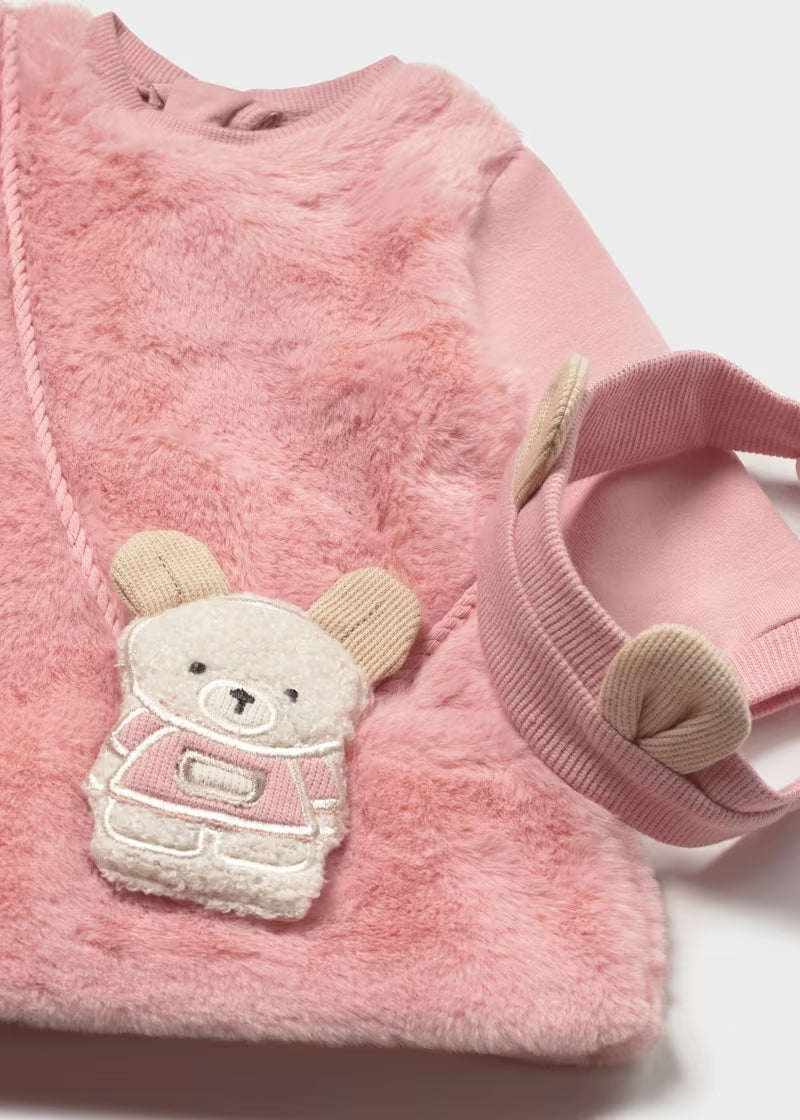 Close-up of the Mayoral pink baby dress with textured finish and mouse bag appliqué