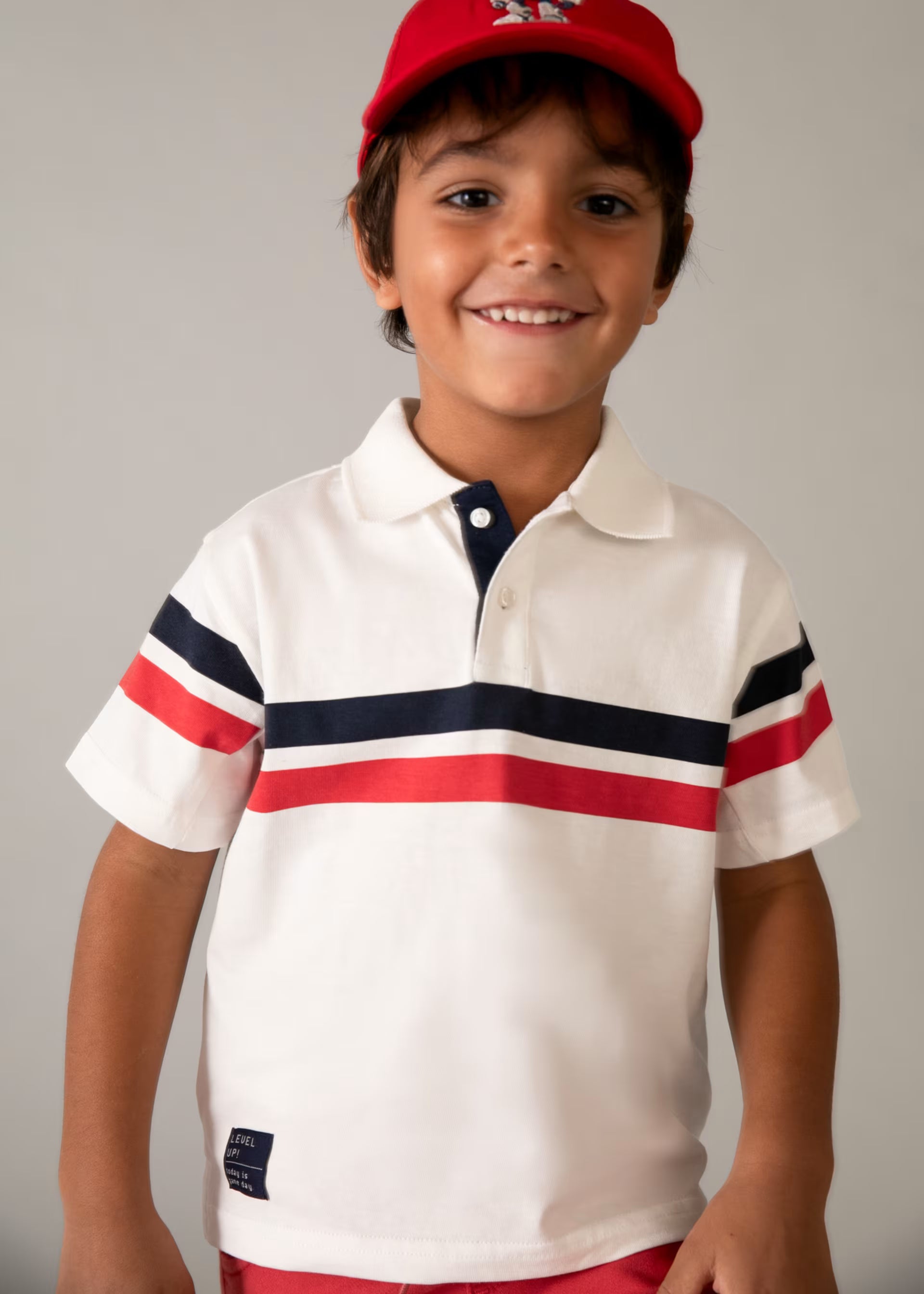 Mayoral boys cream striped polo top worn on model Aged 8 years