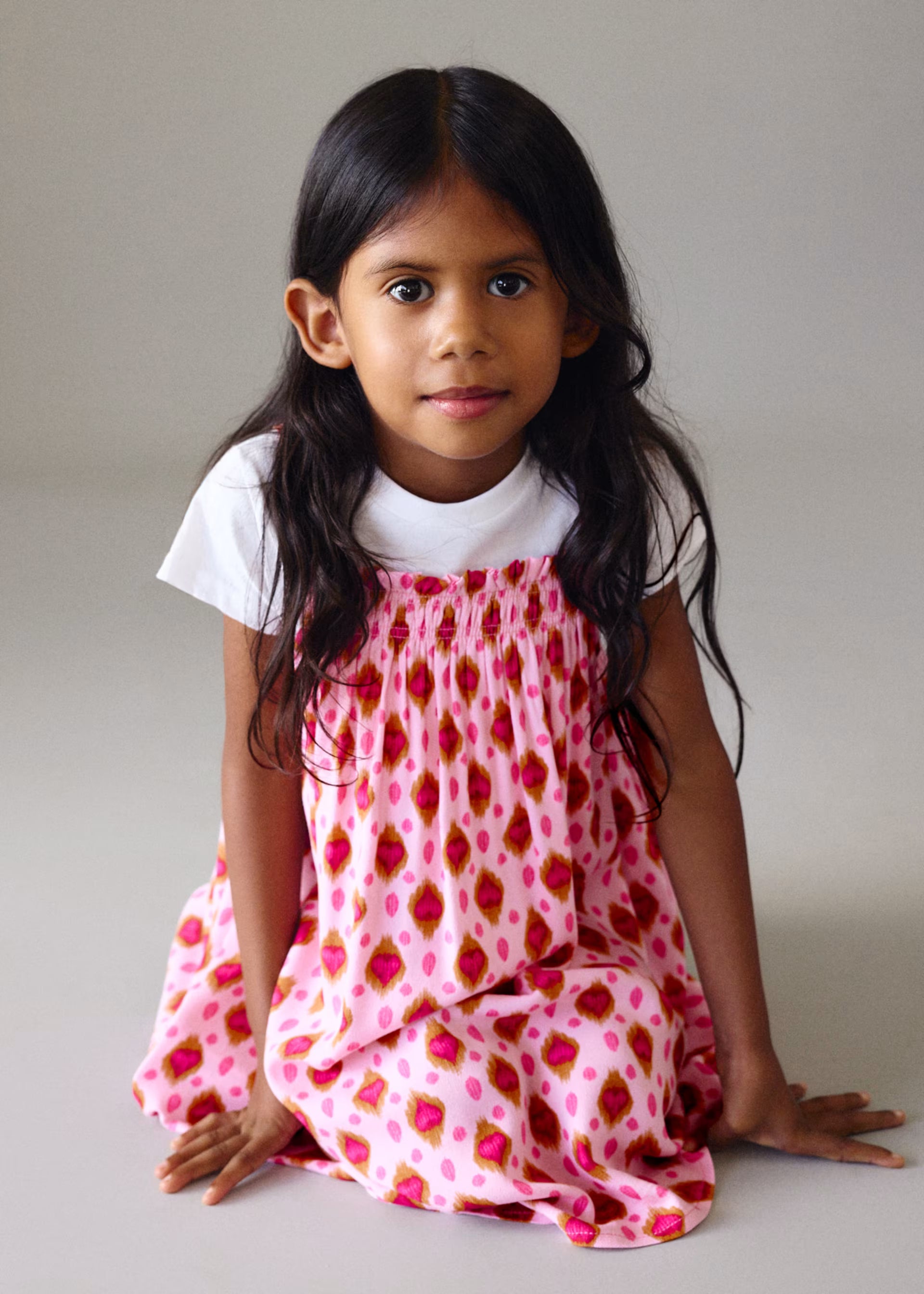 Mayoral girls pink patterned dress on girl aged 6