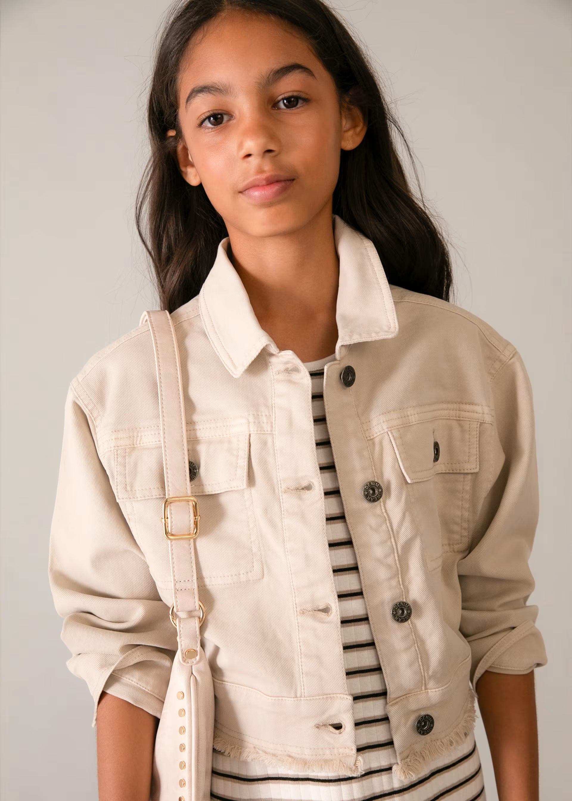 Mayoral girls beige cropped jacket worn by girl ages 10-13