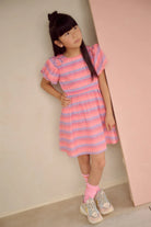 NoNo girls pink and coral stripe dress full length on model