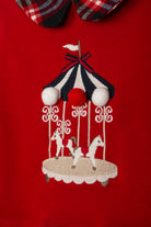 Girl wearing Patachou red carousel and tartan Christmas dress