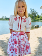 Patachou girls red floral skirt and top set worn outdoor