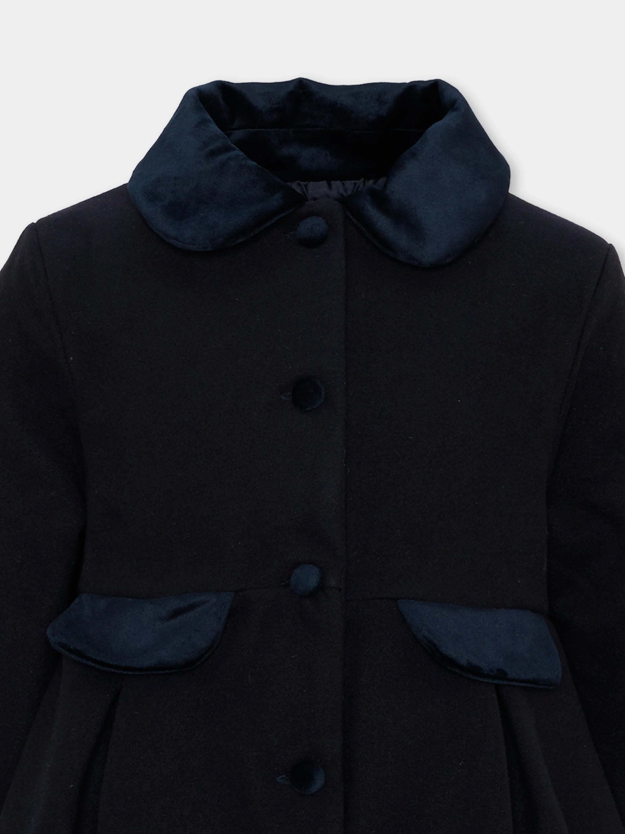 Close-up of Patachou navy wool coat with satin collar and pocket trim