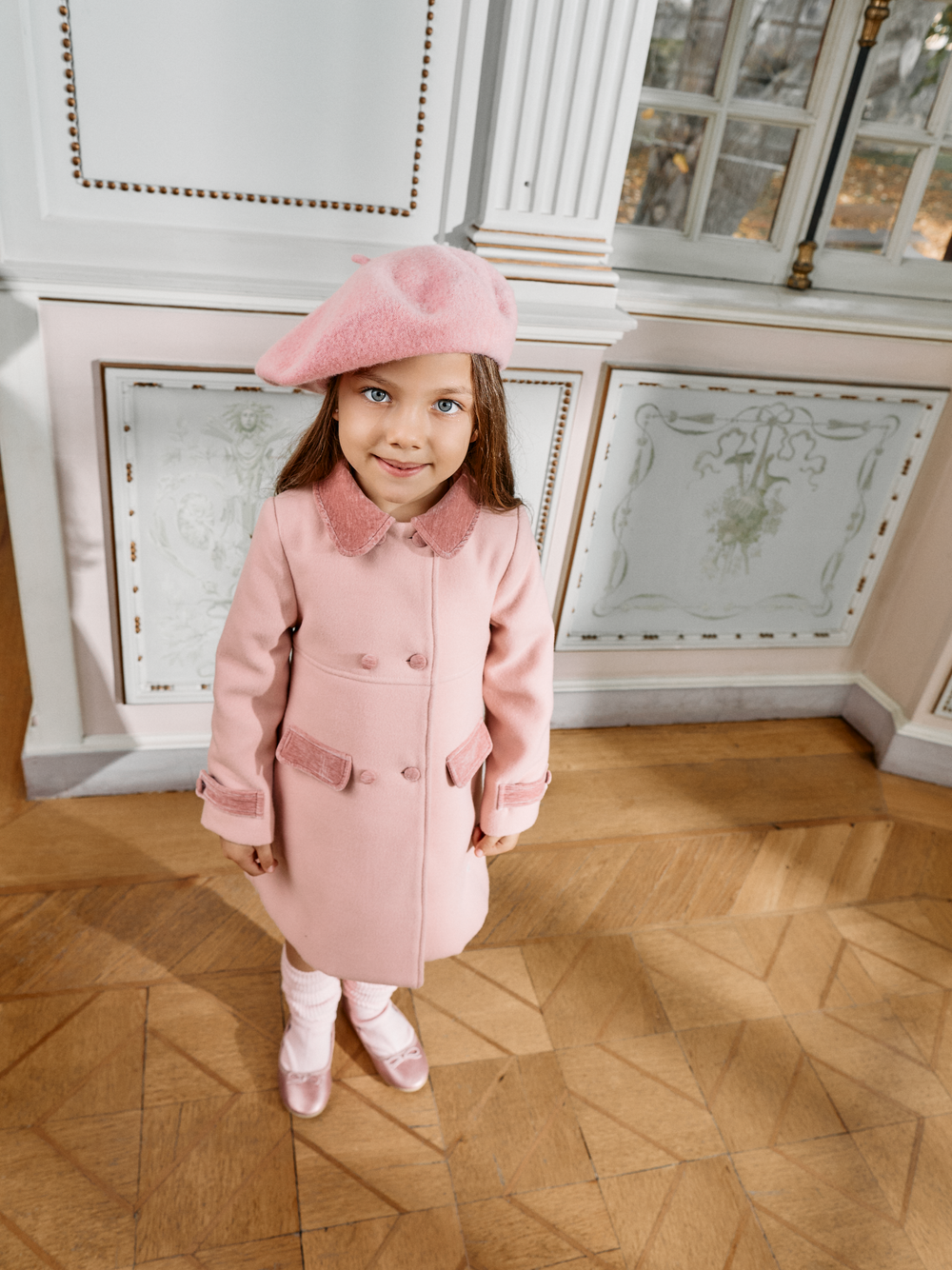 Girl wearing Patachou pale pink occasion coat with matching pink beret