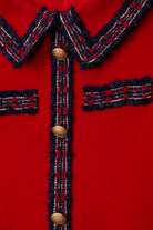 Close-up of Patachou girls red knit dress with contrast trim and buttons