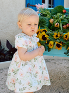 Patachou girls white floral dress worn outdoors at and occasion 