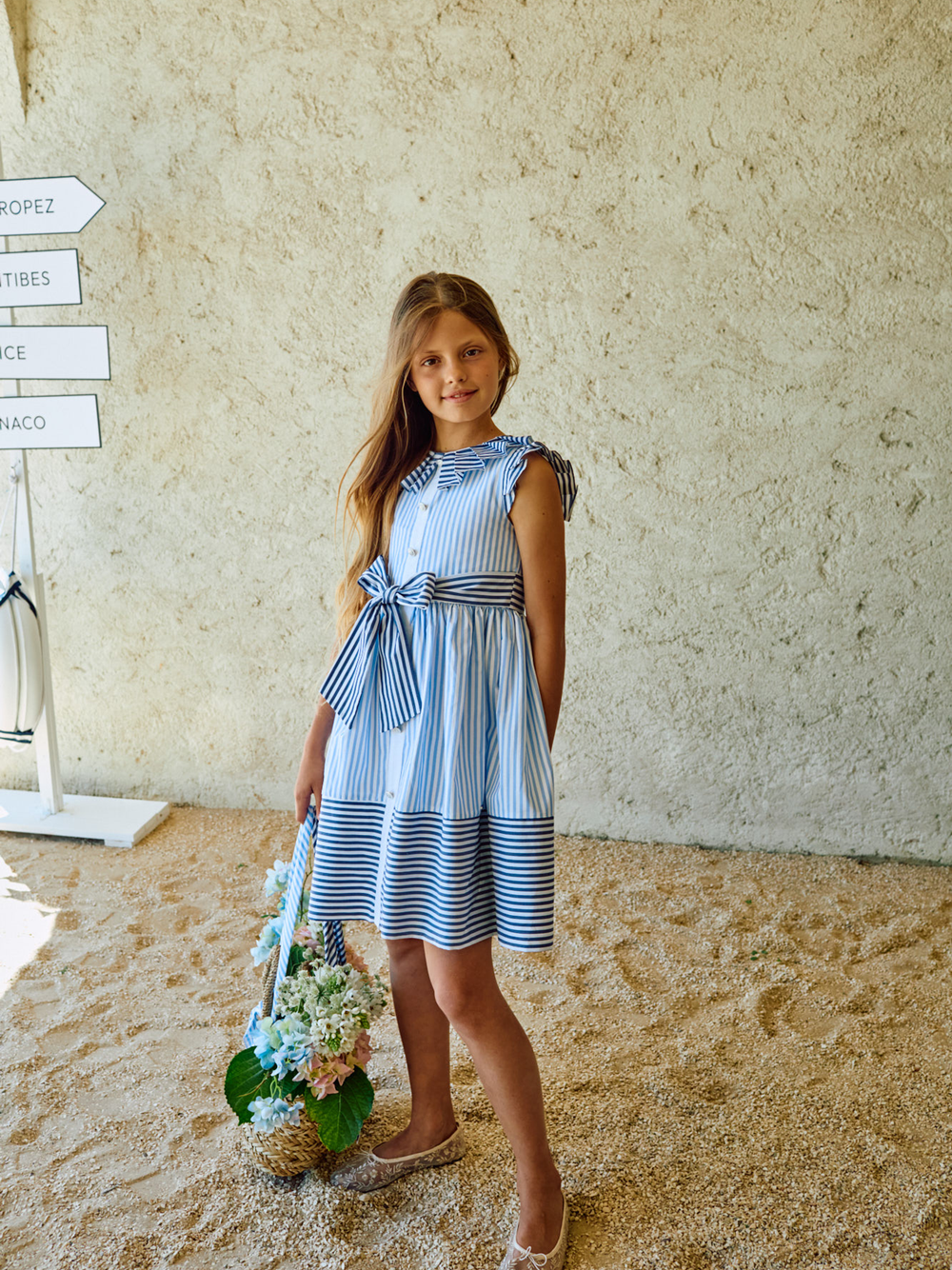 Patachou girls blue striped dress worn outdoor at an occasion