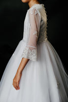 Poinsettia ‘Mila’ White Communion Dress With Sheer Long Lace Sleeves