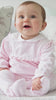 Baby girl wearing Emile et Rose Maddy pink velour babygrow video