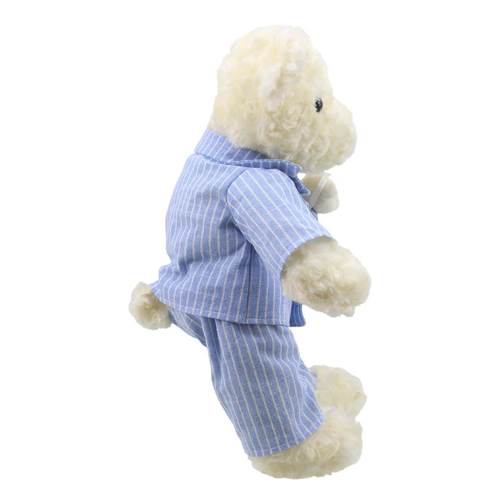 The Puppet Company cream kids teddy bear in blue pyjamas side profile