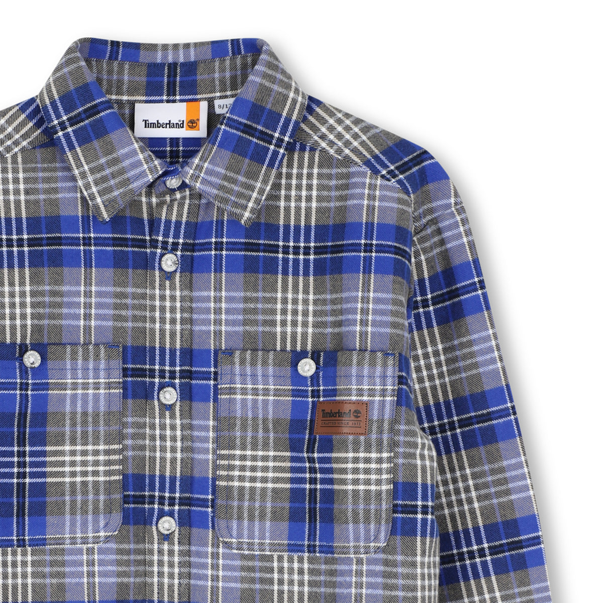 Close-up of Timberland boys checked shirt with button front and chest pockets