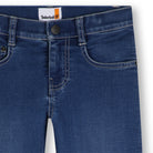 Close-up of Timberland boys blue jeans showing waistband, button fastening and contrast stitching