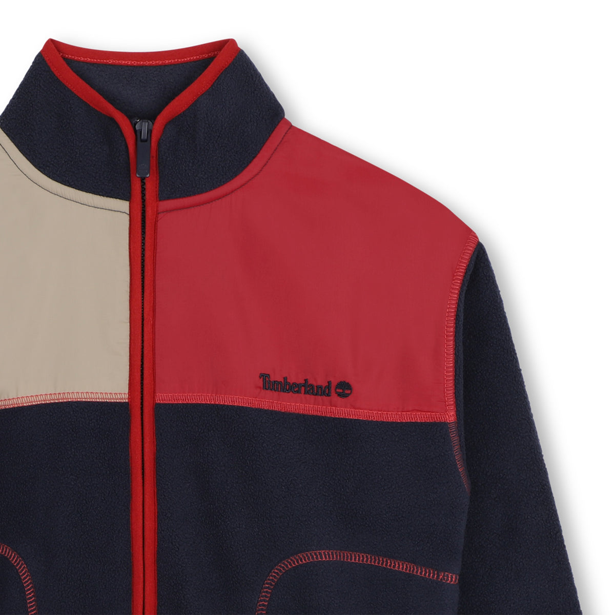 Close-up of Timberland boys fleece jacket with zip collar and colour block panels