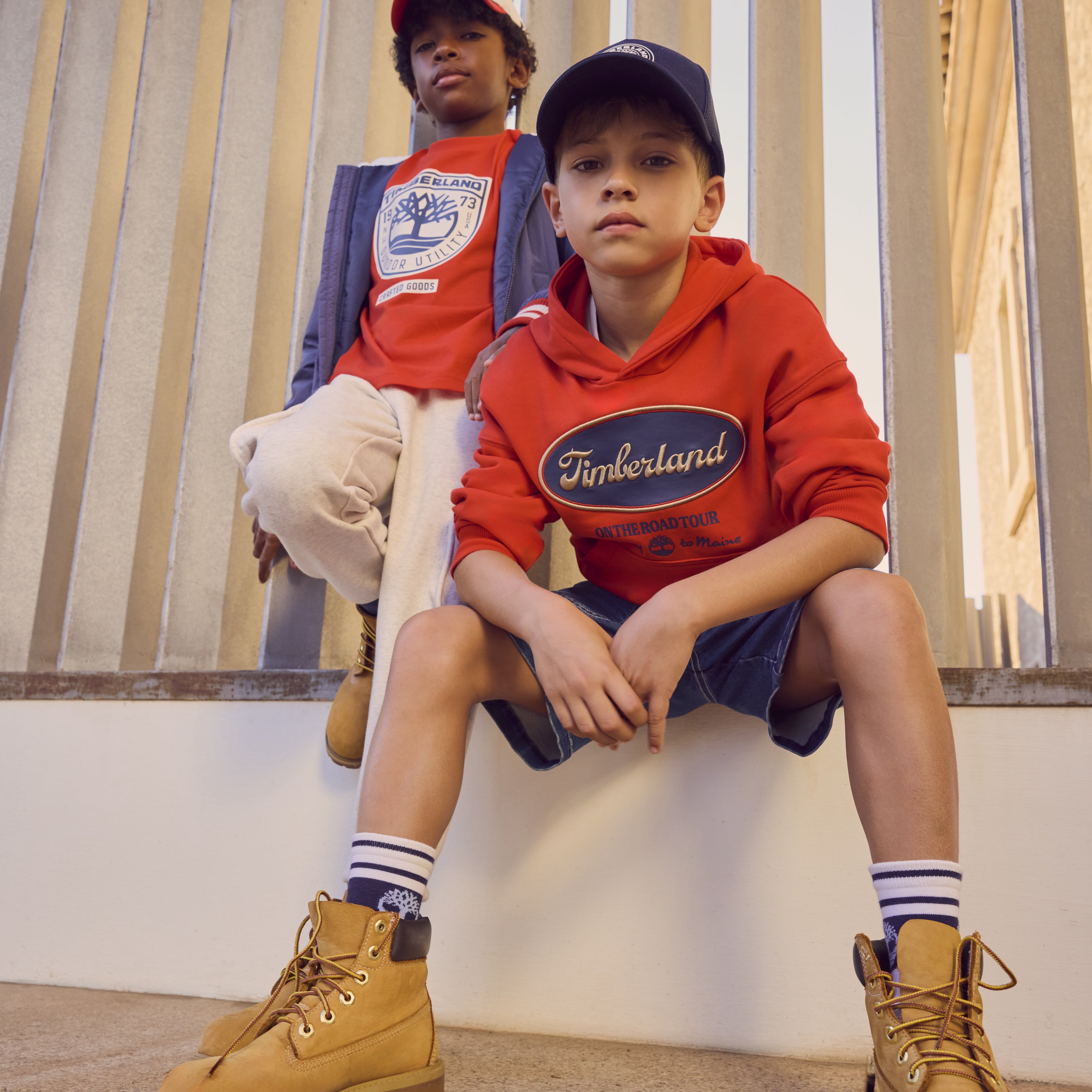 Timberland boys red summer T-shirt worn with casual shorts