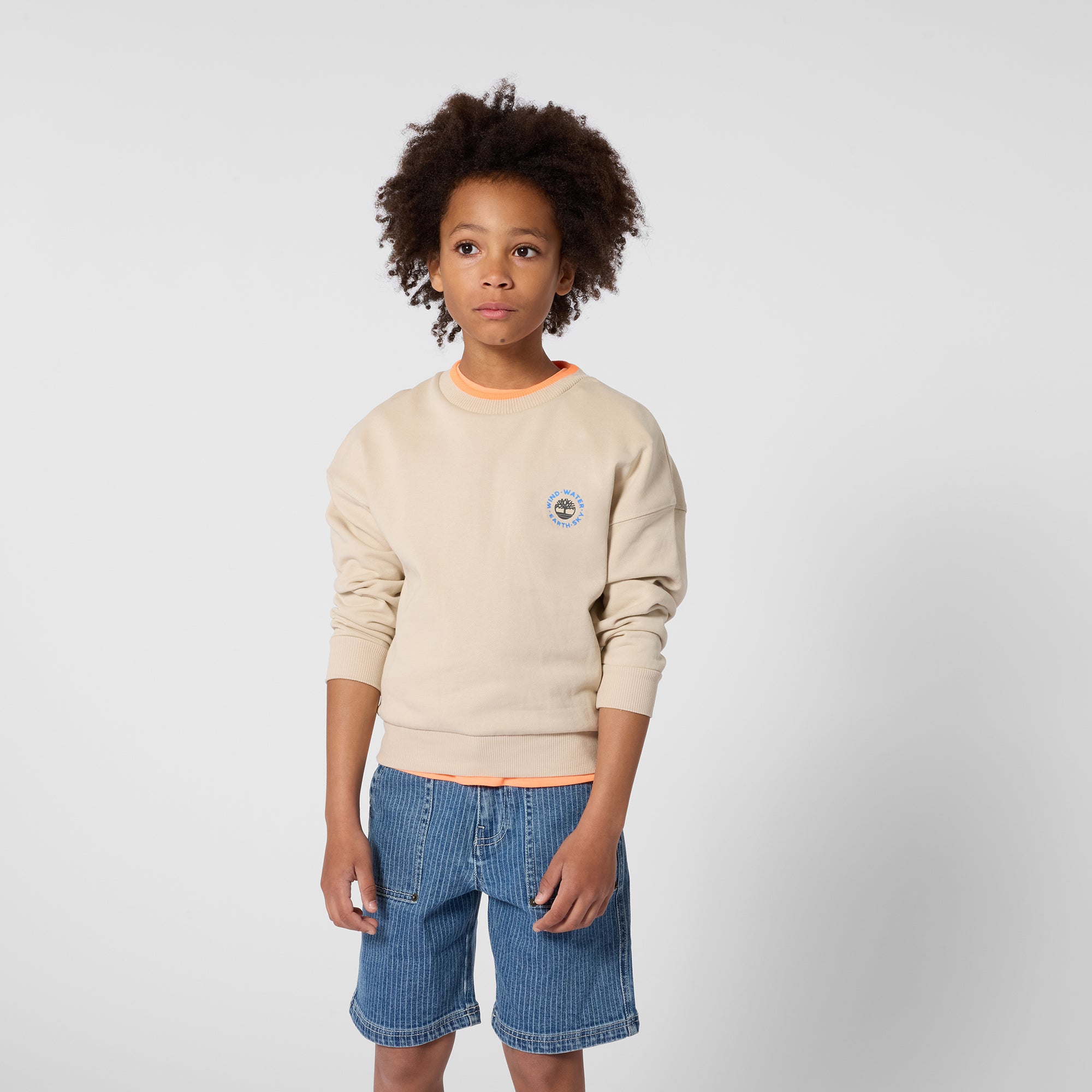 Timberland boys logo sweatshirt styled with denim shorts