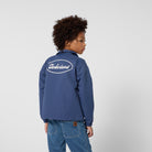     Timberland boys collared jacket back view worn with Timberland logo