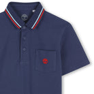     Timberland boys smart navy polo shirt close-up with chest pocket logo