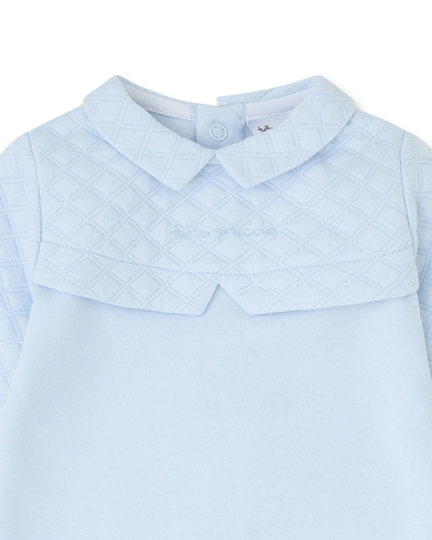 Close-up of Tutto Piccolo sky blue baby romper padded yoke and collar