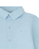 Close-up of Tutto Piccolo porcelain blue chambray shirt collar and buttons